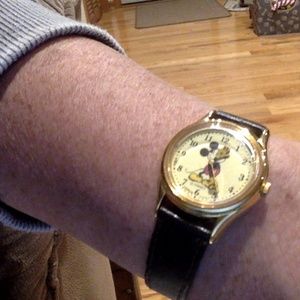 Vintage Mickey Mouse Lotus watch with black leather band.